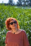 Woman redhead watching the sky royalty free stock photo Woman redhead watching the sky royalty free stock photo
