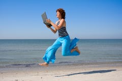 Woman Running And Lookinng To Laptop Royalty Free Stock Photos
