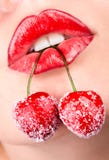 Woman S Mouth With Red Cherries Royalty Free Stock Photography