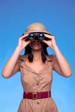 Woman in safari hat looking through binoculars royalty free stock images Woman in safari hat looking through binoculars royalty free stock images