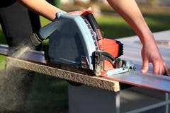 Woman sawing wood royalty free stock image Woman sawing wood royalty free stock image