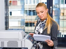 Woman Secretary With Copy Machine Royalty Free Stock Images