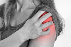 Woman with shoulder pain is holding her aching arm stock images Woman with shoulder pain is holding her aching arm stock images