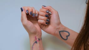 Woman shows her new manicure. Purple nail royalty free stock image Woman shows her new manicure. Purple nail royalty free stock image