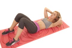 Woman sit up red yoga mat stock photo Woman sit up red yoga mat stock photo