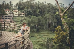 Woman Sits On Bench Overlooking Tall Trees At Daytime Royalty Free Stock Images Woman Sits On Bench Overlooking Tall Trees At Daytime Royalty Free Stock Images