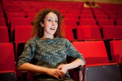 Woman sitting on armchairs at cinema stock image Woman sitting on armchairs at cinema stock image