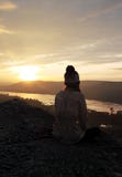 Woman sitting on cliff with sunrise royalty free stock image Woman sitting on cliff with sunrise royalty free stock image