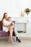 Woman is sitting on the couch with her son and daughter royalty free stock photography Woman is sitting on the couch with her son and daughter royalty free stock photography