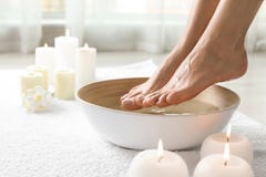 Woman Soaking Her Feet In Dish Indoors, Closeup With Space For Text. Royalty Free Stock Image