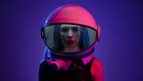 Woman in space helmet. Multi-colored neon lighting
