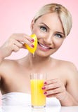 Woman Squeezes The Juice From The Lemon Stock Images Woman Squeezes The Juice From The Lemon Stock Images