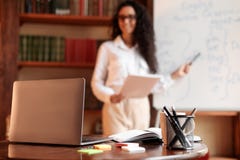Woman Standing At Whiteboard, Focus On Laptop Stock Images