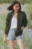 Woman standing in the grass field stock photography Woman standing in the grass field stock photography
