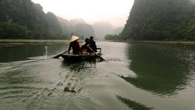 The woman steered the boat with her legs royalty free stock photography The woman steered the boat with her legs royalty free stock photography