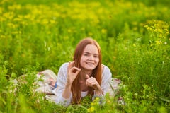 Woman Stiiting On The Green Grass Royalty Free Stock Photography