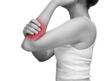Woman suffering from arm pain, painful in arm muscles. mono tone stock images Woman suffering from arm pain, painful in arm muscles. mono tone stock images