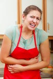 Woman suffering from stomach ache abdominal pain. Stock Photography Woman suffering from stomach ache abdominal pain. Stock Photography