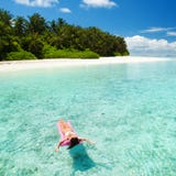 Woman Swim And Relax In The Sea. Happy Island Lifestyle. White Sand, Crystal-blue Sea Of Tropical Beach. Vacation At Paradise. Stock Photos