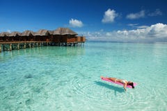 Woman swim and relax on inflatable mattress in the sea royalty free stock photos Woman swim and relax on inflatable mattress in the sea royalty free stock photos