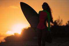 Woman in swimsuit holding a surfboard royalty free stock photos Woman in swimsuit holding a surfboard royalty free stock photos
