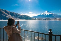 Woman take photo on mountain Fuji. stock images Woman take photo on mountain Fuji. stock images
