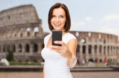 https://thumbs.dreamstime.com/t/woman-taking-selfie-smartphone-over-coliseum-people-technology-tourism-travel-concept-young-background-55905028.jpg