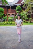 Woman in Thai traditional dress at wooden house stock image Woman in Thai traditional dress at wooden house stock image