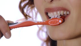 Woman with toothbrush