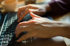 A woman is typing on the keyboard to send a message royalty free stock photo A woman is typing on the keyboard to send a message royalty free stock photo