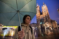 Woman with umbrella in rainy Krakow Poland royalty free stock photography Woman with umbrella in rainy Krakow Poland royalty free stock photography