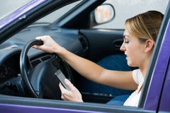 Woman Using Cell Phone While Driving Car royalty free stock image Woman Using Cell Phone While Driving Car royalty free stock image