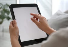 Woman Using Modern Tablet At Home, Closeup. Space For Design Royalty Free Stock Photos