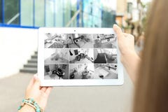 Woman Using Tablet For Monitoring CCTV Cameras Royalty Free Stock Photos