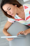 Woman using tablet from home stock images Woman using tablet from home stock images