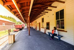 Woman visits the Little River train station near akaroa, Christchurch royalty free stock images Woman visits the Little River train station near akaroa, Christchurch royalty free stock images