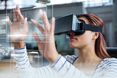 Woman in VR headset touching interfaces