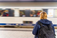 Woman waiting for a train in unrecognizable subway station, motion blur stock images Woman waiting for a train in unrecognizable subway station, motion blur stock images