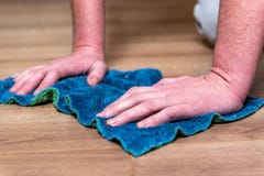 Woman washing floor with blue rag. royalty free stock image Woman washing floor with blue rag. royalty free stock image