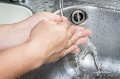 Woman washing hand under running Royalty Free Stock Images Woman washing hand under running Royalty Free Stock Images