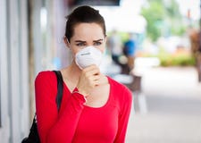 Woman wearing mask coughing stock photo Woman wearing mask coughing stock photo