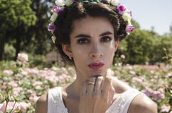 Woman in White Floral Headdress and White Sleeveless Top Behind Pink Flower Field at Daytime Royalty Free Stock Image Woman in White Floral Headdress and White Sleeveless Top Behind Pink Flower Field at Daytime Royalty Free Stock Image