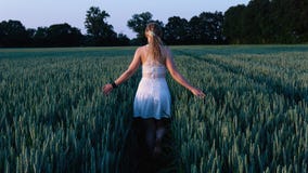 Woman in White Sleeveless Mini Dress Standing Between Grass Field Royalty Free Stock Photos Woman in White Sleeveless Mini Dress Standing Between Grass Field Royalty Free Stock Photos