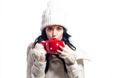 Woman in winter clothes drinking coffee Royalty Free Stock Images Woman in winter clothes drinking coffee Royalty Free Stock Images