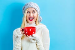 Woman in winter clothes drinking coffee Royalty Free Stock Image Woman in winter clothes drinking coffee Royalty Free Stock Image