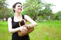 Woman With Basket In The Garden Stock Photos
