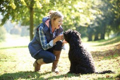 Woman With Dog Royalty Free Stock Images