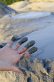 Woman With Mud On Fingers Stock Photography