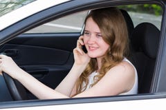 Woman With The Phone Behind The Wheel Of Car Royalty Free Stock Photos Woman With The Phone Behind The Wheel Of Car Royalty Free Stock Photos