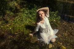 Woman With White Dress Near Stream Of Water Stock Photos